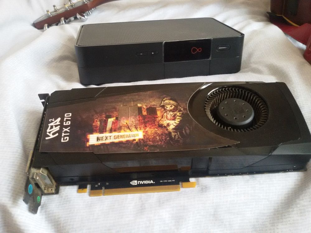 Exploded V6 Virgin TV box and Fried Graphics card from my pc.jpg