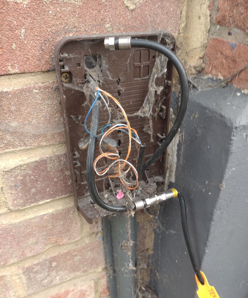 brown cover broken, cables exposed