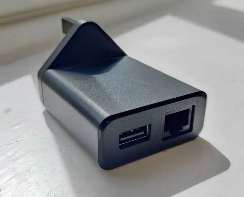 Stream power plug incorporating ethernet adapter
